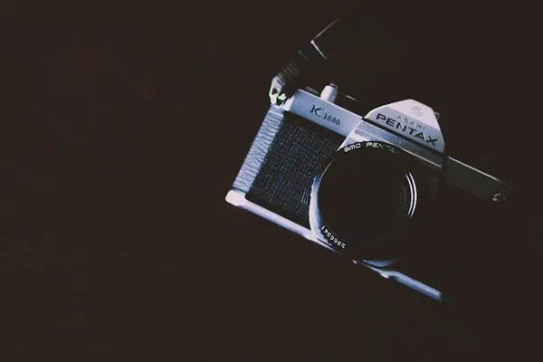 Vintage film camera used during a male boudoir photography session