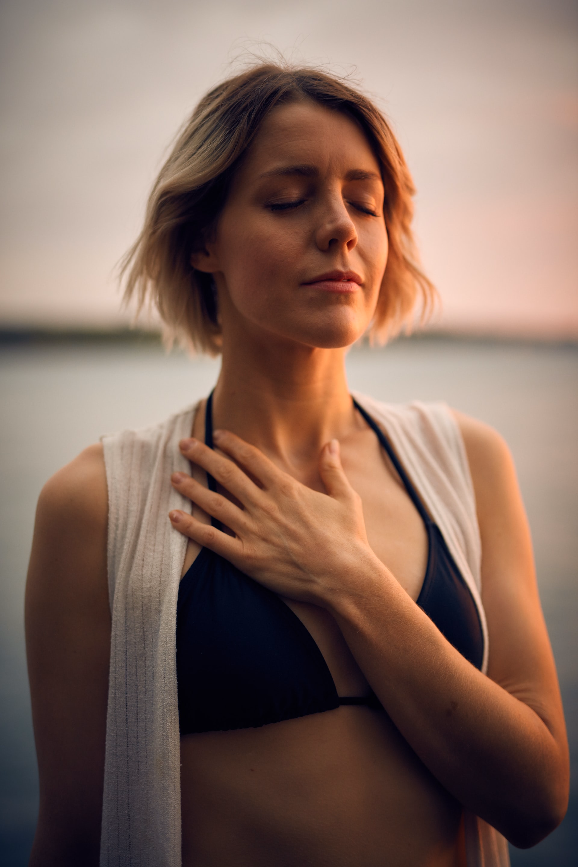 Woman posing during a boudoir session at Lake Tahoe, hand to chest